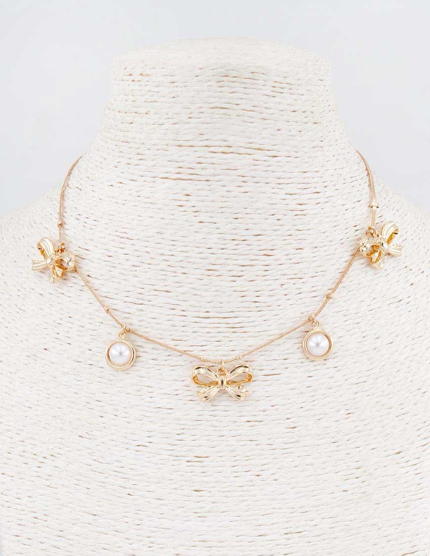 Gold Bow and Pearl Necklace